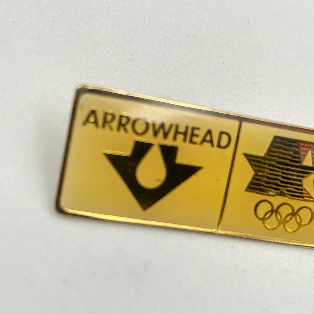 Vintage 1980 LAOLY Arco Olympics Classic Gold-Tone Arrowhead Water Lapel Pin 80s